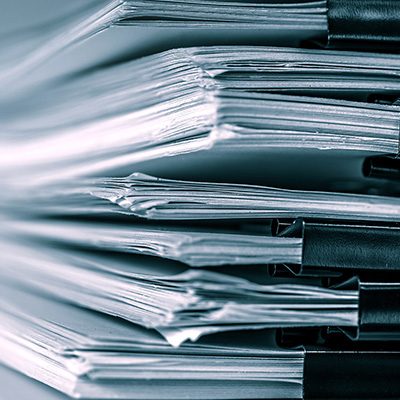 extreamely close up report paper stacking of office working doc extreamely close up a report paper stacking of office working document , retro color tone